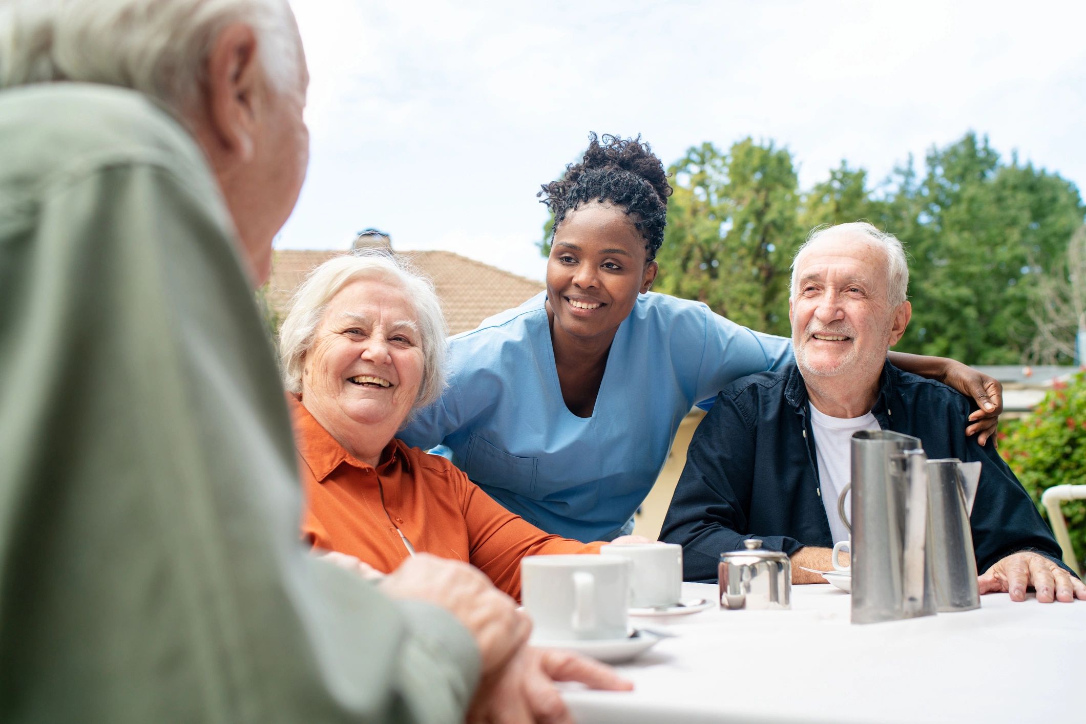 Peaceful outdoor garden with seniors enjoying the sunshine